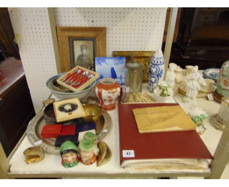 A box of assorted item, WW2 scrap album, medals, Delft, plated items, Pewter tankard and misc. china