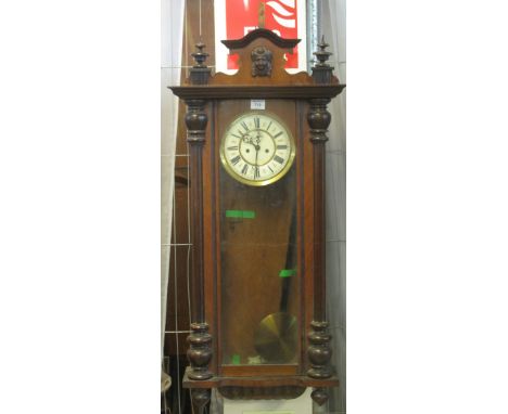 Early 20th Century walnut two train, Vienna type wall clock with key and pendulum.(B.P. 24% incl. VAT)