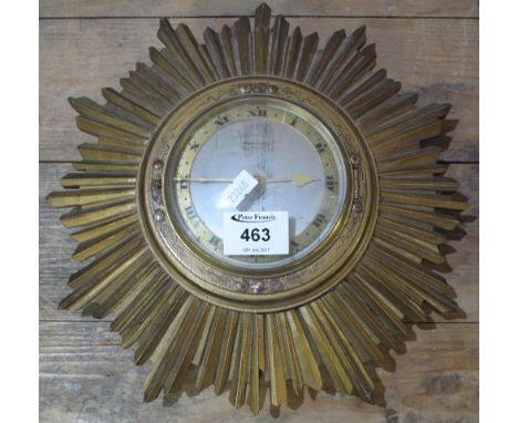 Gilded wooden sunburst wall clock.(B.P. 24% incl. VAT)