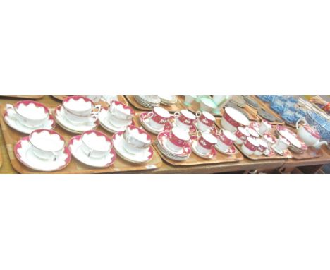 Three trays of 19th Century Staffordshire teaware with gilt and burgundy floral and foliate decoration, together with a simil