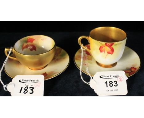 Two similar Royal Worcester porcelain cabinet cups and saucers hand painted with berries and leaves within gilt borders, prin