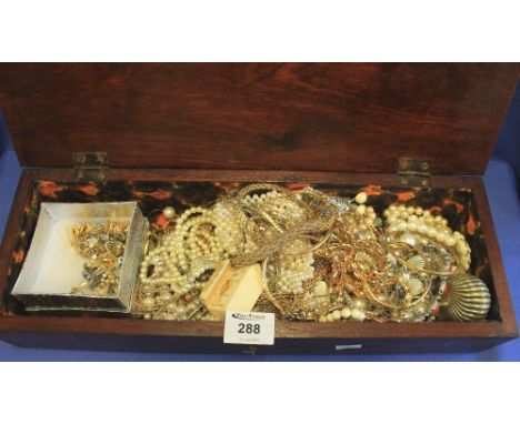 Rectangular box containing assorted costume jewellery to include: bangles; snuff box; pearls; pendants on chains; earrings et