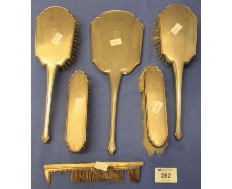 Lady's silver vanity set comprising: four brushes; mirror and comb, Birmingham hallmarks, Mappin and Webb.(B.P. 24% incl. VAT