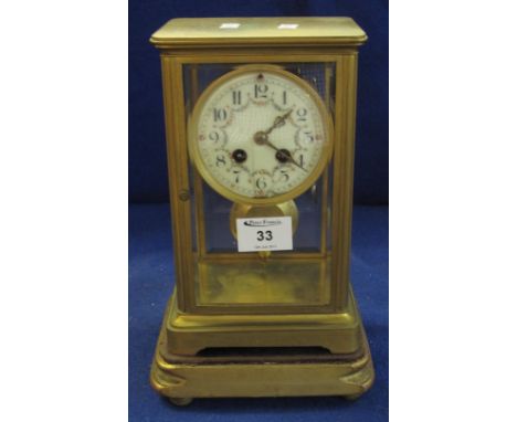 Late 19th Century French gilt brass four glass mantel clock with enamelled face and two train drum movement striking on one g