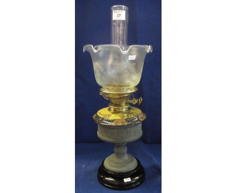 Early 20th Century brass double burner oil lamp with ceramic reservoir in a white metal pedestal base with ceramic platform, 
