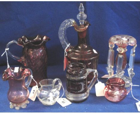 Cranberry glass baluster jug with clear handle and fluted rim, together with a ruby glass baluster carafe with clear stopper 