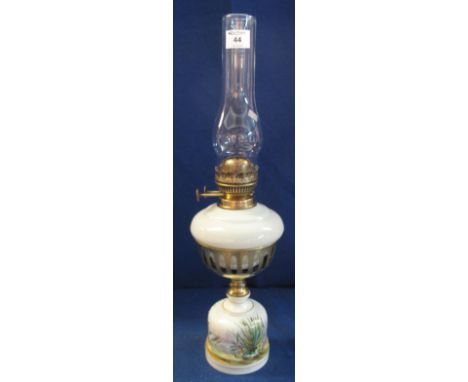 Early 20th Century brass double burner oil lamp with milk glass reservoir and hand painted ceramic base, clear chimney.(B.P. 