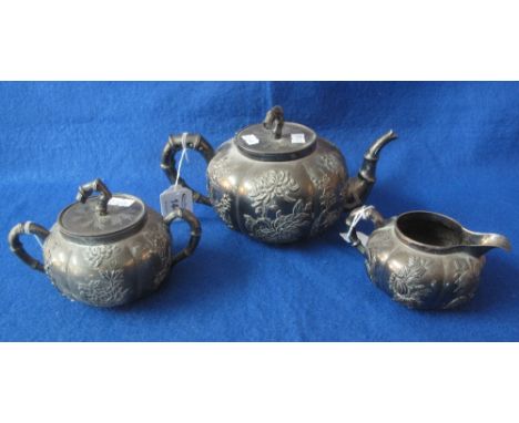 Japanese white metal, three piece, melon shaped, fluted tea set, overall with relief chrysanthemum and other floral decoratio