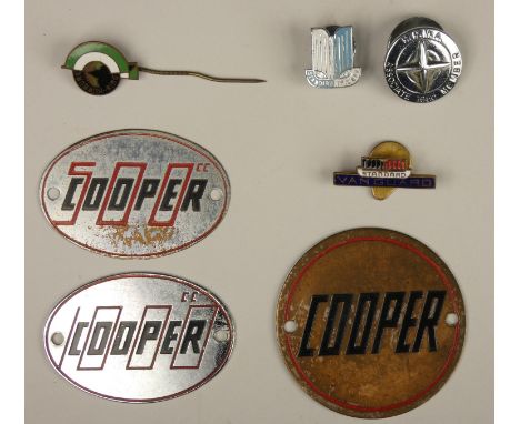 A Cooper enamel and chrome circular badge, two Cooper 500cc badges, A Nürburgring stick pin, a B.R.M.A associate mechanic 195