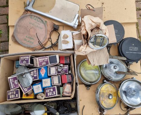 An autojumblers lot, to include a NOS Lucas King of the Road 8 1/2" lamp glass, a pair of NOS chrome bullet wing mirrors and 