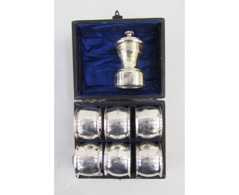 Cased set of six Edwardian engraved silver-plated napkin rings, each engraved with a shield-shape escutcheon and scrolls, sta