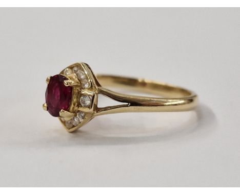 14ct gold ruby and white stone ring, set oval ruby surrounded by small diamonds in elliptical setting size O