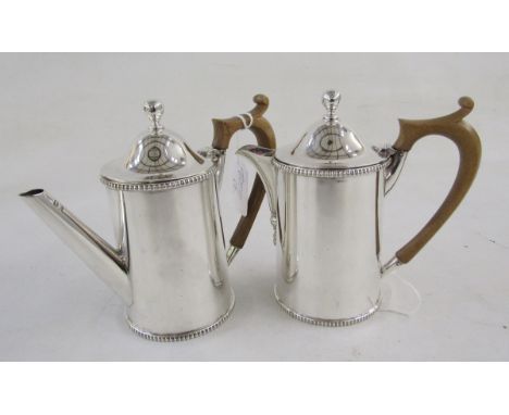 George V silver teapot and a hot-water jug and cover,&nbsp;the hot-water jug hallmarked London, 1911, and the teapot 1912, in