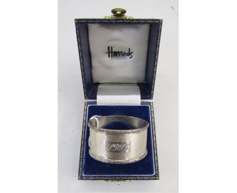 20th century silver napkin ring, oval form with engine turned decoration, hallmarked Birmingham 1973, by D Bros, housed in a 