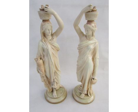 Pair of Royal Worcester blush ivory ground models of water carriers, late 19th century, printed puce and impressed marks and 