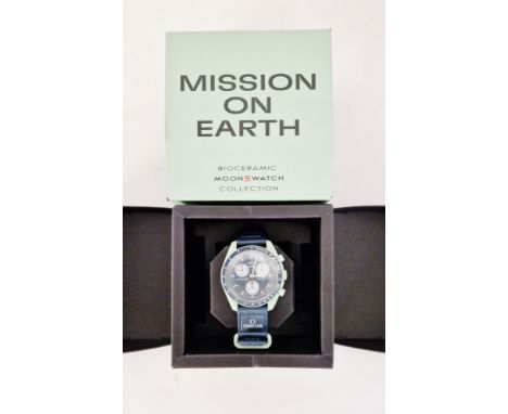 Omega Swatch Speedmaster Moonswatch 'Mission on Earth' quartz movement, on original strap in original boxCondition ReportThe 