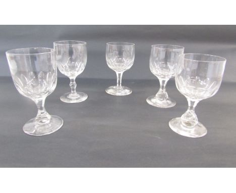 Assembled set of five cut glass water goblets, probably early 20th century, each bowl cut with ovolos above baluster and face