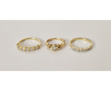 9ct gold solitaire diamond ring size I1/2,&nbsp;and two 9ct gold diamond set half eternity style rings both size P1/2 (3)