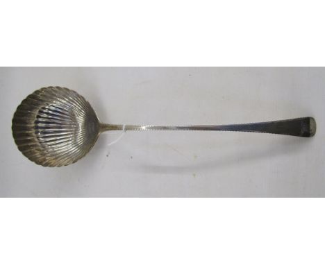 Georgian silver sauce ladle, the bowl shaped as a scallop shell, bright cut handle, hallmarks rubbed, approximately 155g/4.9o