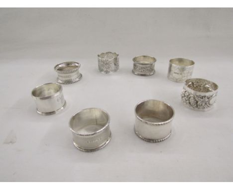Collection of eight silver napkin rings, of varying designs including pierced and engine turned, gross weight approximately 2