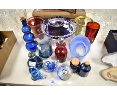 A selection of art glass, including blue hued cut glass tazza, paperweights, ruby glass vase with etched stag design and simi