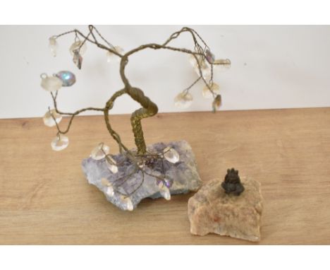 A novelty solid brass lucky pixie pipe tamper set within a quartz rock together with a wire gemstone tree