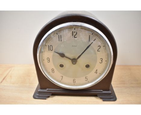 A 1930s bakelite cased mantel clock, Enfield, Made in England.