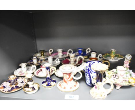A collection of vintage ceramic candlesticks, including Staffordshire and one bearing crossed swords to base.
most in good co