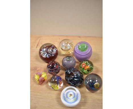 A selection of paperweights, including Caithness miniature pansy.