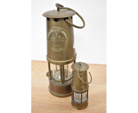 A 20th Century Eccles miner's lamp, Type 6, measuring 25cm tall, together with a miniature miner's lamp
