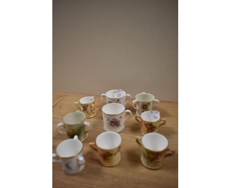A collection of 19th/20th Century Royal Worcester porcelain tyg and loving cups, the largest measures 5cm tall