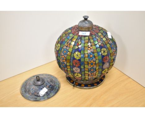 A middle Eastern styled ceiling light of colourful glass.