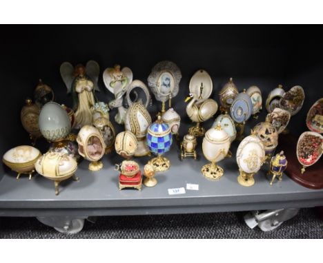 A selection of trinket boxes, most of egg shaped form, also included are some ornamental scenes housed inside egg shaped form