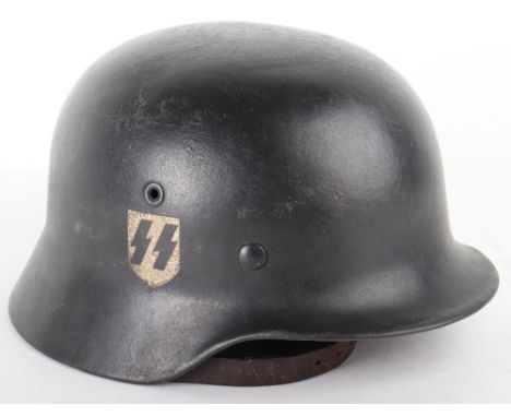 WW2 German M-40 Pattern Steel Combat Helmet, having a dark black paint finish to the exterior with a later applied Waffen-SS 