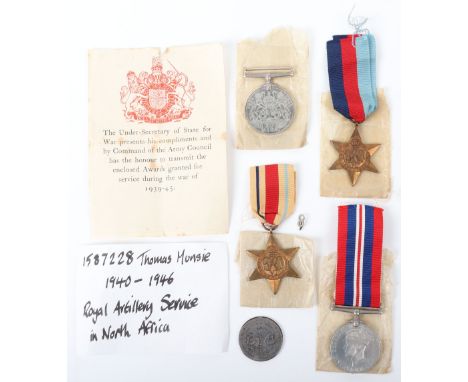 British WW2 Campaign Medal Group of Four, consisting of 1939-45 star, Africa Star with 8th army medal ribbon emblem, Defence 