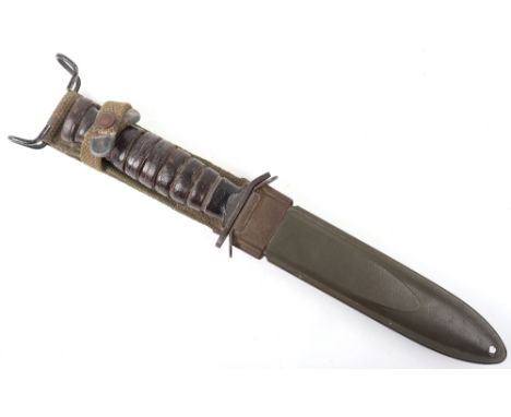 American US M8 Knife Bayonet, with leather covered grip and steel top pommel. Steel downturned cross guard. Housed in its ori