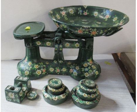 A painted set of metal scales, together with weights