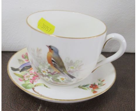 A Royal Worcester cup and saucer, decorated with birds by PowellCondition Report:  Cup is in good condition, but the saucer i