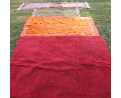 A yellow ground Eastern design rug, 76ins x 42ins, together with a runner, 101ins x 24ins and two other rugs