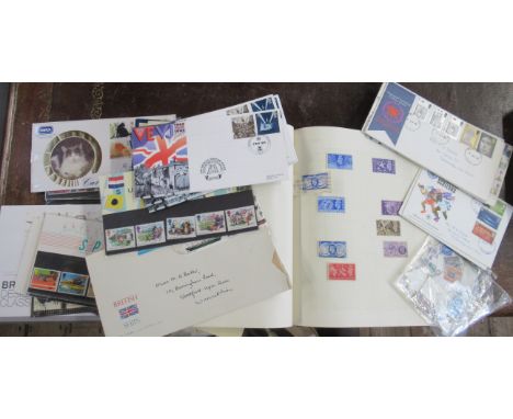 A collection of First Day Cover stamps, together with a stamp album to include 1948 Olympic Games, Festival of Britain etc
