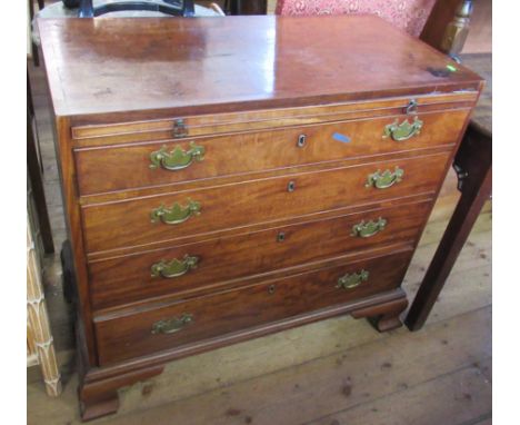A 19th century mahogany chest of drawers, with slide brushing tray over, four graduated long drawers, raised on bracket feet,