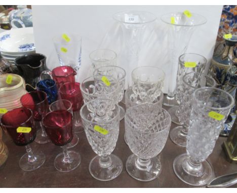A collection of glassware including cranberry examples