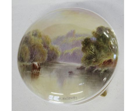 A porcelain covered trinket pot, the lid decorated with a cattle in river and castle on hill beyond by M Holloway, diameter 4