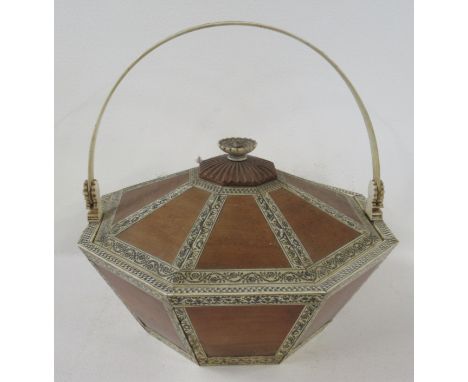 A mid 19th century sandalwood and engraved ivory covered sewing box, attributed to Sedachellum, of octagonal form, with swing