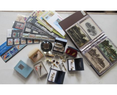 A collection of First Day Cover stamps, a collection of local postcards, Worcester and surrounding area, various cuff links e