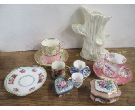 A collection of decorative ceramics, to include a miniature Royal Worcester mug, decorated with roses, two coffee cans and sa