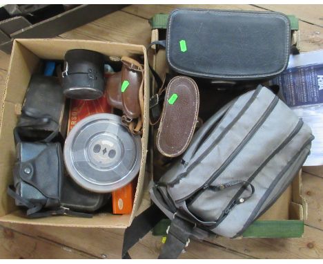 A collection of vintage cameras, binoculars etc