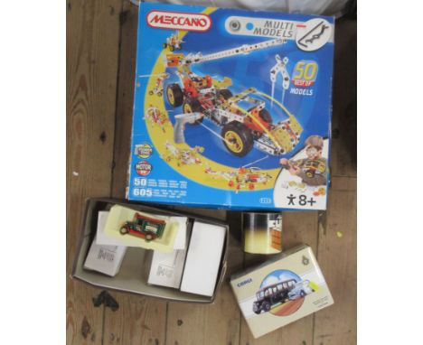 A boxed set of Meccano, together with model cars