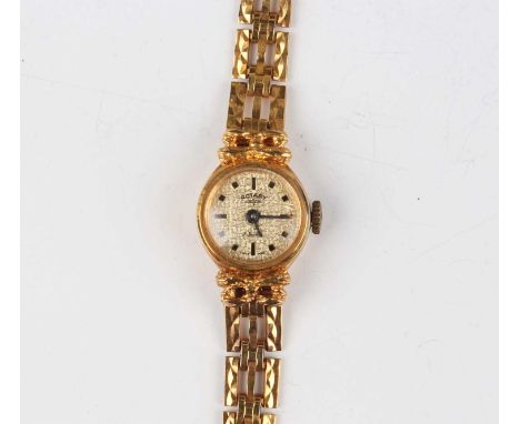 A Rotary 9ct gold lady’s bracelet wristwatch, the signed textured dial with black hour markers, cast bow motifs to the case, 