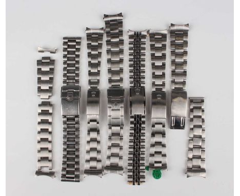 A group of five Rolex Oyster stainless steel watch bracelets with foldover clasps, comprising a 78350 bracelet with 557 endli